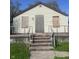 An exterior shot of a house with boarded up windows on a sunny day at 3242 Collier St, Indianapolis, IN 46221