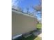 View of the home's side exterior showcasing the siding and yard at 3242 Collier St, Indianapolis, IN 46221