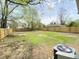 Spacious backyard with green grass and a new wooden fence at 3411 Chase St, Indianapolis, IN 46217