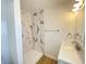 Modern bathroom with beautiful tile shower, updated fixtures and a stylish vanity with ample counter space at 3411 Chase St, Indianapolis, IN 46217