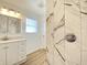 Stylish bathroom featuring a shower with a modern shower head and sleek, updated vanity and fixtures at 3411 Chase St, Indianapolis, IN 46217