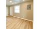 Bedroom featuring a window, a door, hardwood style floors, and recessed lighting at 3411 Chase St, Indianapolis, IN 46217