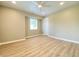 Spacious bedroom featuring a ceiling fan, natural light from a window, and light hardwood style floors at 3411 Chase St, Indianapolis, IN 46217