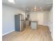 Bright kitchen featuring stainless appliances, an eat-in island, light gray cabinets and modern finishes throughout at 3411 Chase St, Indianapolis, IN 46217