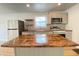 Contemporary kitchen with stainless steel appliances, granite countertops, decorative backsplash and a spacious kitchen island at 3411 Chase St, Indianapolis, IN 46217