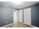 This bedroom has neutral walls and flooring with doors to other rooms or closets at 350 N Meridian N St # 701, Indianapolis, IN 46204