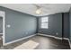 Bright bedroom with hardwood floors and a ceiling fan at 350 N Meridian N St # 701, Indianapolis, IN 46204