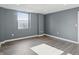 Bright bedroom with gray walls, hardwood floors, and a large window at 350 N Meridian N St # 701, Indianapolis, IN 46204