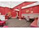 Cozy dining area featuring vibrant red walls and comfortable booth seating, perfect for intimate gatherings at 350 N Meridian N St # 701, Indianapolis, IN 46204