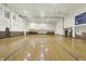 Full-sized gymnasium featuring a hardwood basketball court, perfect for sports and recreation at 350 N Meridian N St # 701, Indianapolis, IN 46204