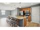 Open kitchen featuring a large island with bar seating and stainless steel appliances at 350 N Meridian N St # 701, Indianapolis, IN 46204