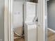 Laundry closet with stacked washer and dryer and wire shelving at 350 N Meridian N St # 701, Indianapolis, IN 46204