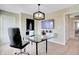 Comfortable home office with a glass desk, stylish decor, and wall-mounted TV at 3730 Cantebury Dr, Franklin, IN 46131