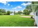 The expansive backyard features a storage shed, mature trees, and well-maintained lawn at 374 S Baldwin St, Bargersville, IN 46106