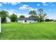 Spacious backyard with well-maintained lawn, patio, and inviting back of house at 374 S Baldwin St, Bargersville, IN 46106