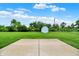 Large backyard with a storage shed, framed by lush green grass and blue sky at 374 S Baldwin St, Bargersville, IN 46106