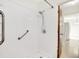 A clean walk-in shower featuring grab bars and a shower head at 374 S Baldwin St, Bargersville, IN 46106