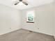 Bedroom featuring neutral carpet, a ceiling fan and a window with blinds at 374 S Baldwin St, Bargersville, IN 46106