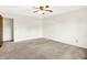 Spacious bedroom featuring neutral carpet, a ceiling fan with light fixture, and white walls at 374 S Baldwin St, Bargersville, IN 46106