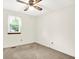 Bright bedroom featuring neutral carpet, ceiling fan and a window with sheer curtains at 374 S Baldwin St, Bargersville, IN 46106