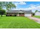 Charming brick home with an attached garage and well-manicured front yard with beautiful curb appeal at 374 S Baldwin St, Bargersville, IN 46106