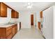 Bright kitchen with vinyl floor, wood cabinets, white appliances and plenty of counter space at 374 S Baldwin St, Bargersville, IN 46106