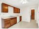 Traditional kitchen with oak cabinets, a white countertop, and a double bowl sink at 374 S Baldwin St, Bargersville, IN 46106