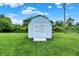 Light blue storage shed in the backyard provides ample space for gardening equipment at 374 S Baldwin St, Bargersville, IN 46106