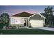 Charming home features a lovely landscaped yard, attached garage, and traditional architectural details at 3778 Cantebury Dr, Franklin, IN 46131