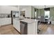Modern kitchen with an island, stainless steel appliances, seating and open concept design to the dining area at 3778 Cantebury Dr, Franklin, IN 46131