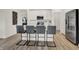 Modern kitchen with a large island, seating, stainless steel appliances and ample cabinet space at 3778 Cantebury Dr, Franklin, IN 46131