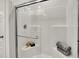 Modern glass-enclosed shower featuring sleek fixtures and a comfortable built-in bench at 3778 Cantebury Dr, Franklin, IN 46131
