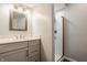 Clean bathroom with a gray vanity, a brushed nickel mirror, and a stand-up shower at 411 Woodland W Dr, Greenfield, IN 46140