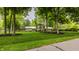 Charming two-story home with well-manicured lawn and mature trees at 411 Woodland W Dr, Greenfield, IN 46140