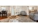 Open living room with a decorative cabinet, hardwood floors, and armchairs at 411 Woodland W Dr, Greenfield, IN 46140