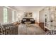 Cozy living room featuring hardwood floors, large windows, and comfortable seating arrangement at 411 Woodland W Dr, Greenfield, IN 46140