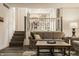 Open concept living room features staircase access, comfortable seating, and stylish decor at 411 Woodland W Dr, Greenfield, IN 46140