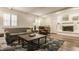 Cozy living room with a decorative fireplace, plush sofas, and stylish rug at 411 Woodland W Dr, Greenfield, IN 46140