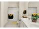 Bright bathroom with a glass-enclosed shower, double sink vanity, and decorative accents at 49 Manchester Dr, Trafalgar, IN 46181