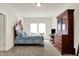 Comfortable bedroom with carpet, wood furniture, and bright natural light at 49 Manchester Dr, Trafalgar, IN 46181