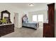 Cozy main bedroom featuring carpet, wood furniture, and an en-suite bathroom at 49 Manchester Dr, Trafalgar, IN 46181