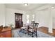 Charming dining area with hardwood floors, stylish furniture, and plenty of natural light at 49 Manchester Dr, Trafalgar, IN 46181