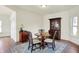 Traditional dining area with hardwood floors, classic furniture, and natural light at 49 Manchester Dr, Trafalgar, IN 46181