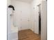 Inviting entryway with coat rack and adjacent closet doors; utility closet also visible at 49 Manchester Dr, Trafalgar, IN 46181