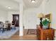 Inviting entryway with classic wood furniture and a view into dining area at 49 Manchester Dr, Trafalgar, IN 46181