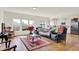 Inviting living room with hardwood floors and an open concept design flowing into the adjacent kitchen at 49 Manchester Dr, Trafalgar, IN 46181