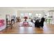 Bright open-concept living room with stylish decor, hardwood floors, and natural light at 49 Manchester Dr, Trafalgar, IN 46181