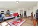 Bright and open living space with hardwood floors, lots of light, and an adjacent kitchen at 49 Manchester Dr, Trafalgar, IN 46181