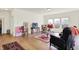 Open-concept living room with natural light, hardwood floors, and cozy furnishings at 49 Manchester Dr, Trafalgar, IN 46181