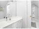 Bright bathroom featuring white cabinetry, single sink vanity and a large mirror at 4956 Waterside Cir, Carmel, IN 46033